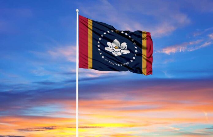 Flag,Of,Mississippi,On,Flagpoles,And,Blue,Sky.,Patriotic,Concept