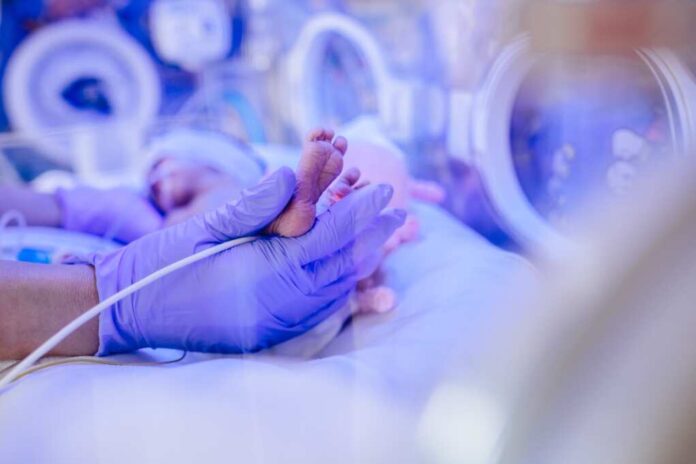 Macro,Photo,Of,Doctor's,Hands,And,Legs,Of,A,Child.