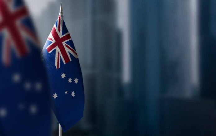 Small,Flags,Of,Australia,On,A,Blurry,Background,Of,The