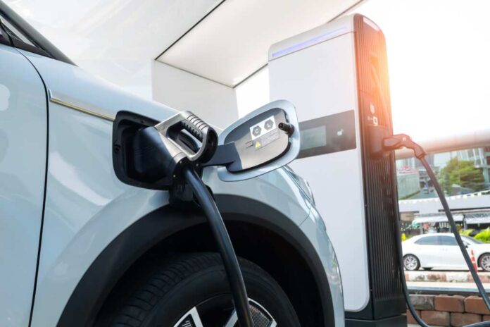 Electric,Car,In,Ev,Charging,Station,,Concept,Of,Green,Energy