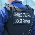Coast Guard officer in uniform with a visible badge