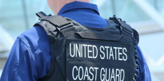 Coast Guard officer in uniform with a visible badge