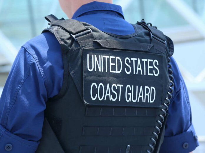 shutterstock435820693jpg Coast Guard officer in uniform with a visible badge
