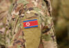 Close-up of a military uniform featuring the North Korean flag