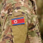 Close-up of a military uniform featuring the North Korean flag