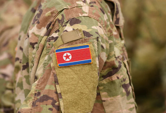Close-up of a military uniform featuring the North Korean flag