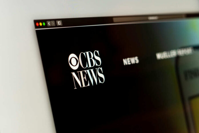 Close-up of CBS News website logo on a computer screen