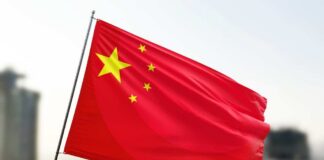 Waving flag of China with a star and four smaller stars