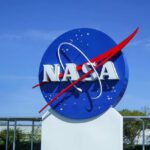 NASA logo displayed against a clear blue sky