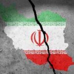 Iranian Espionage Threatens UK’s Nuke Security Map of Iran with the national flag displayed, featuring a crack through it