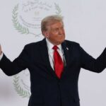 Donald Trump gesturing during a political event