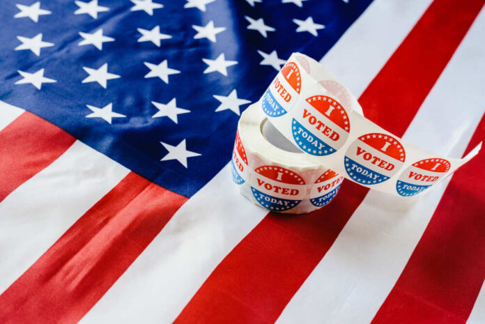Voting stickers on an American flag background