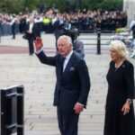King Charles III and Camilla, Duchess of Cornwall, greeting a crowd during a public event