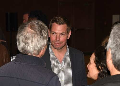 Group of people engaged in conversation at an event