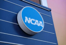 NCAA logo displayed on a blue wall