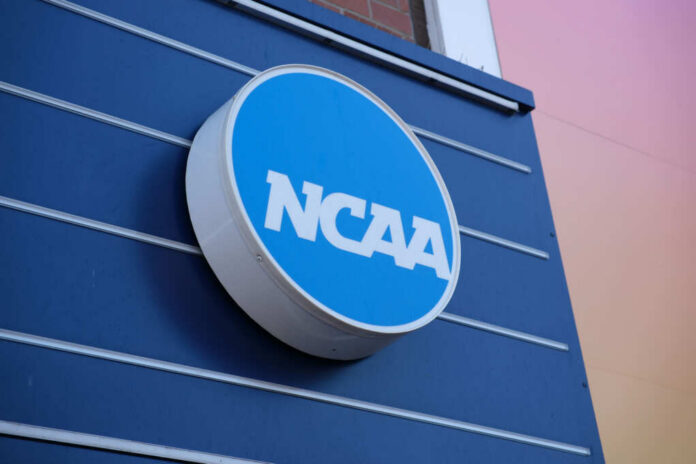 NCAA logo displayed on a blue wall