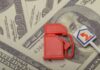 Oil Soars Toward $100: Ceasefire Crumbles Red fuel pump toy next to hundred dollar bills