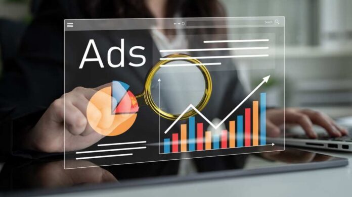 shutterstock_2678609607.jpg Person analyzing advertising data on a digital interface
