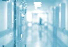 IV drip in a hospital corridor with a blurred background