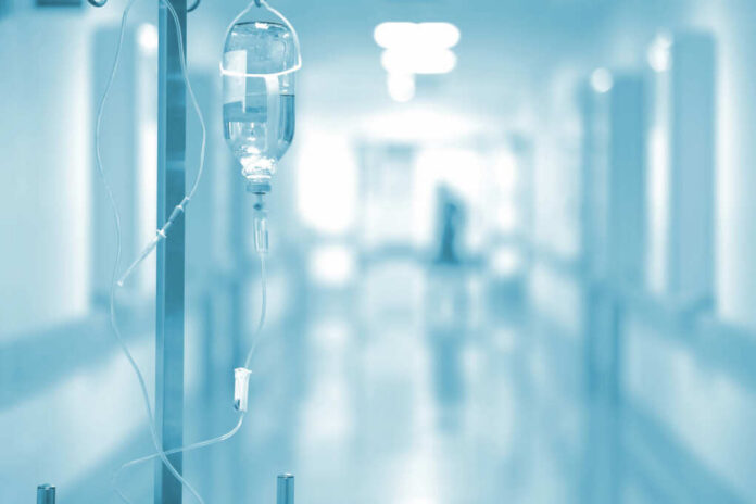 IV drip in a hospital corridor with a blurred background
