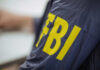 Close-up of an FBI agents jacket with yellow lettering