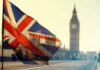 Union Jack flag waving in front of Big Ben in London