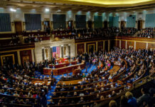 Congress TARGETS Hidden Pro-Beijing Networks A large gathering of officials in a congressional chamber during a legislative session