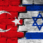 Turkey and Israel flags painted on a brick wall