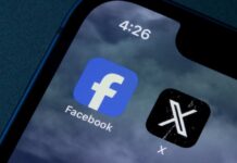 Close-up of smartphone screen displaying Facebook and X app icons