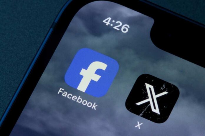 Close-up of smartphone screen displaying Facebook and X app icons
