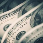 Close-up of folded hundred dollar bills