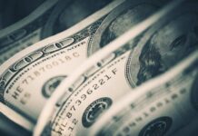 Bank War Shocker: Political Power Struggle Exposed Close-up of folded hundred dollar bills