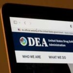 Laptop screen showing DEA website header
