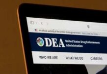 Laptop screen showing DEA website header