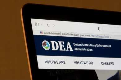 Laptop screen showing DEA website header