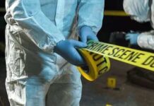 Tennessee Outrage: Grandpa Left Dying Forensic investigators in protective suits setting up crime scene tape