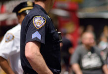 Manhattan Mayhem After Knicks Triumph Close-up of a police officers uniform in a busy urban area