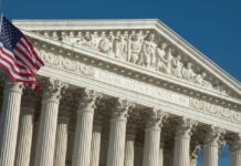 Term Limits Bombshell Targets Supreme Court United States Supreme Court facade with flag and Corinthian columns