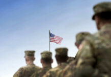 Leaked Audio Explodes at Quantico Soldiers in uniform standing in formation with an American flag in the background