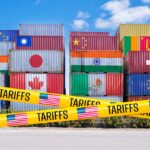 Europe Blinks, Tariff Time Bomb Paused Stacked shipping containers with national flags behind yellow tariffs tape