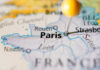 Close-up of a map highlighting Paris with a location pin