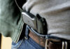 Gun Carry Presumed Legal—Police Reined In A handgun partially visible in a belt holster worn by a person in casual clothing