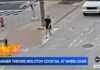 Man in wheelchair set on fire in Molotov cocktail attack outside police HQ