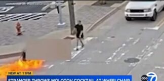 Man in wheelchair set on fire in Molotov cocktail attack outside police HQ