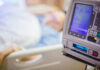 Silent Heatwave Death Toll Explodes IV pump displaying medication flow rate in a hospital room