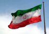 Iranian flag waving on a pole