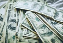 Bid-Rigging Bonanza Drains Housing Funds Stacks of U.S. hundred-dollar bills
