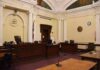 empty courtroom with judge's bench and columns
