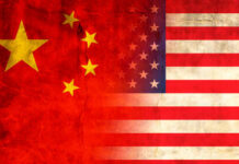 Beijing’s Voter Data Haul Exposed Flags of China and the USA blended together with a textured background