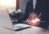 A business professional interacting with a digital representation of AI technology